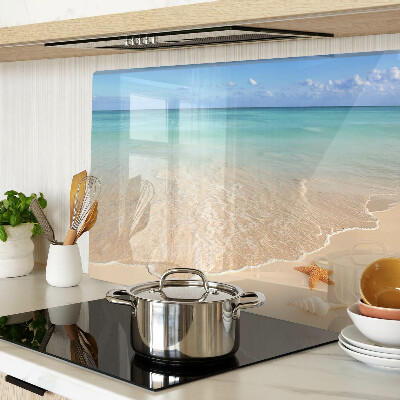 Snijplanken glas Strand met schelpen en golven