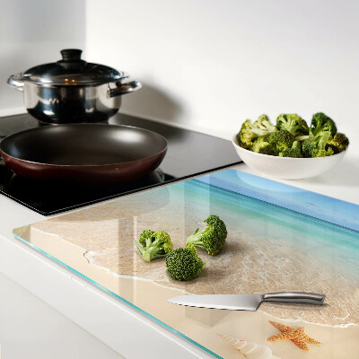 Snijplanken glas Strand met schelpen en golven