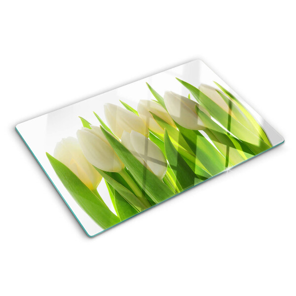 Glazen snijplanken Tulpen tegen een achtergrond van groene bladeren