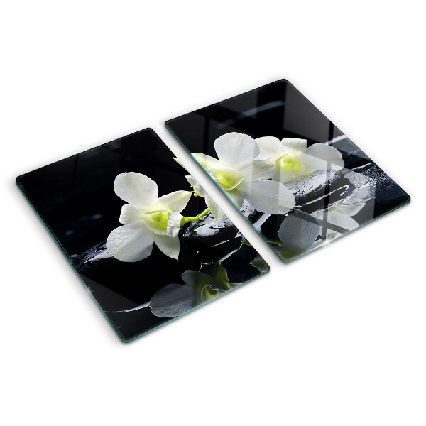 Snijplanken van glas Orchideeën op een zwarte achtergrond