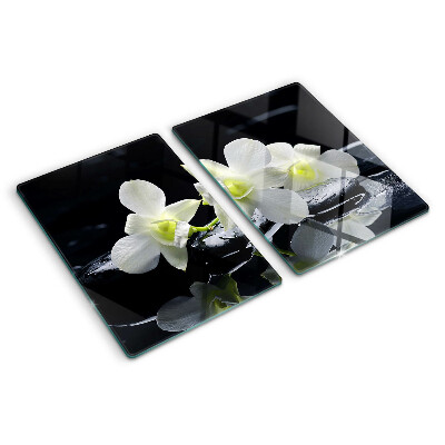 Snijplanken van glas Orchideeën op een zwarte achtergrond