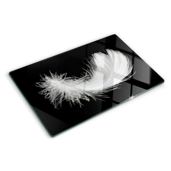 Glazen snijplanken Veer op een zwarte achtergrond