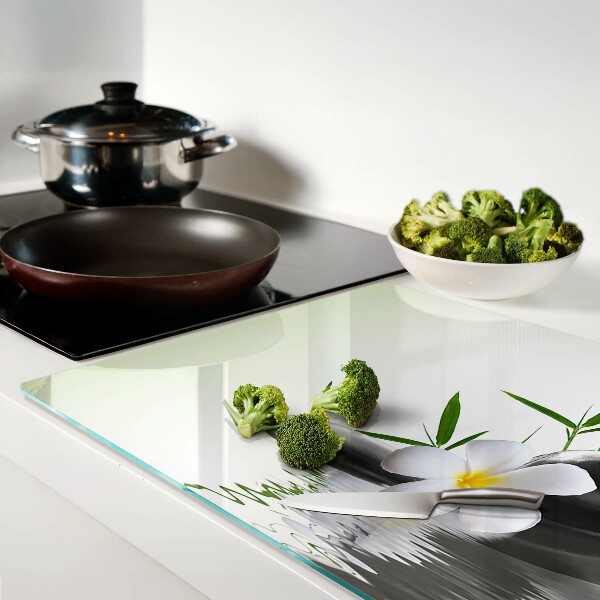 Szklana deska kuchenna Kwiaty i kamienie na wodzie