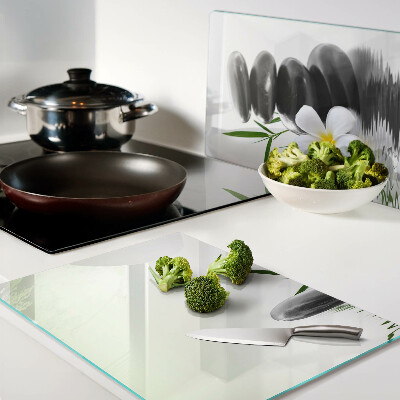 Snijplanken glas Bloemen en stenen op het water