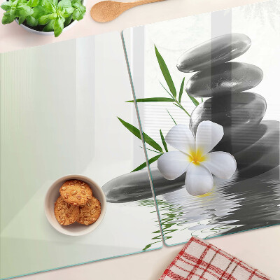 Snijplanken glas Bloemen en stenen op het water