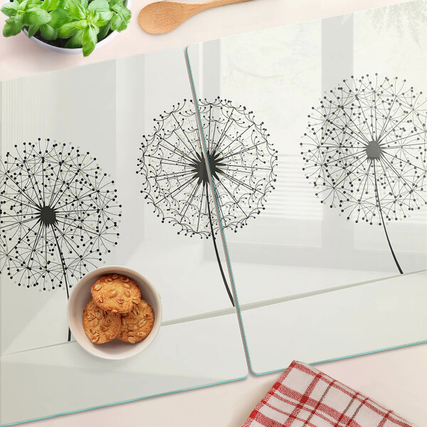 Snijplanken glas Paardenbloemen op een witte achtergrond