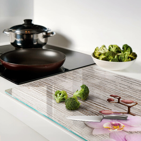 Snijplanken glas Orchideeën op een houten achtergrond