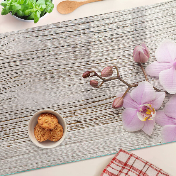 Szklana deska kuchenna Orchidee na tle drewna