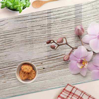Snijplanken glas Orchideeën op een houten achtergrond