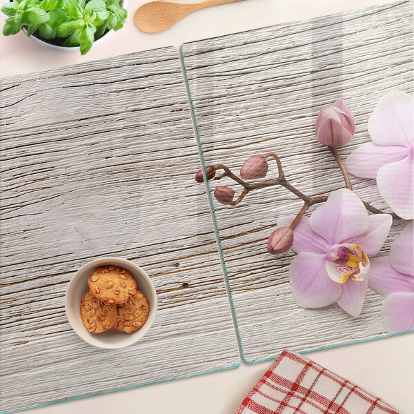 Snijplanken glas Orchideeën op een houten achtergrond