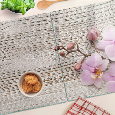 Snijplanken glas Orchideeën op een houten achtergrond