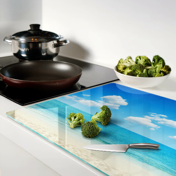 Snijplanken glas Strand met een blauwe lucht