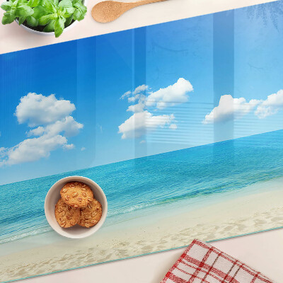 Snijplanken glas Strand met een blauwe lucht