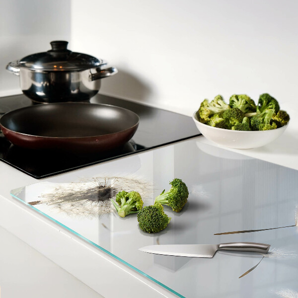 Deska kuchenna szklana Dmuchawce na tle okna