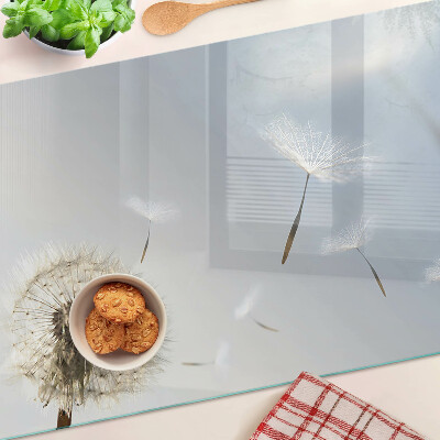 Deska kuchenna szklana Dmuchawce na tle okna