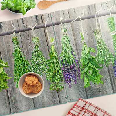 Snijplanken glas Gedroogde kruiden op een houten achtergrond