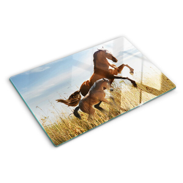 Glazen snijplanken Paarden in een weiland in de zon.