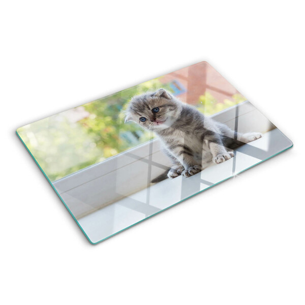 Glazen snijplanken Een kitten op de vensterbank.