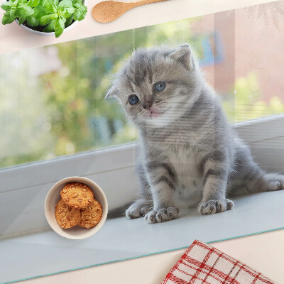 Glazen snijplanken Een kitten op de vensterbank.