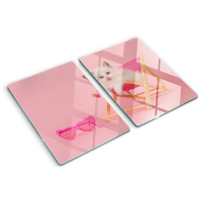 Snijplanken glas Een kitten op een ligstoel tegen een roze achtergrond.
