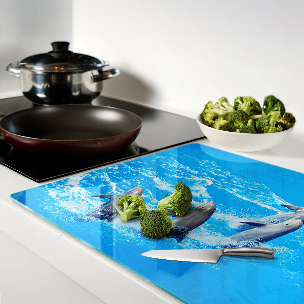 Glazen snijplanken Dolfijnen die over de golven springen