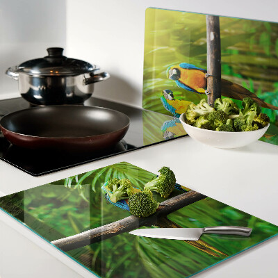 Snijplanken glas Papegaaien op een tak in de tropen