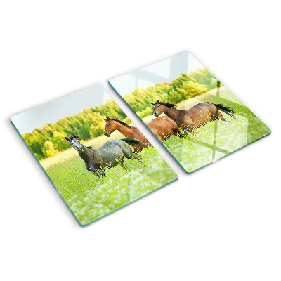 Snijplanken glas Een bijeenkomst van paarden in het veld.