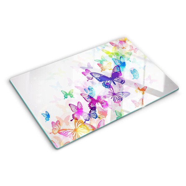 Snijplanken van glas Een motief van kleurrijke vlinders die wegvliegen.