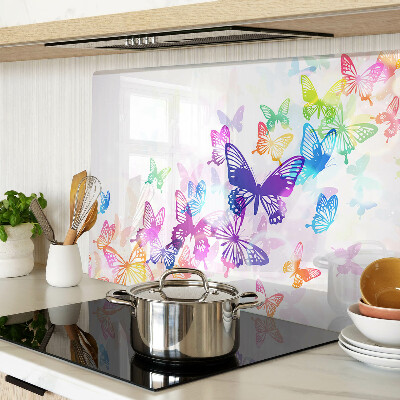 Snijplanken van glas Een motief van kleurrijke vlinders die wegvliegen.