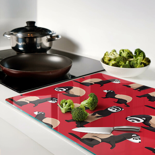 Snijplanken van glas Fretten op een rode achtergrond