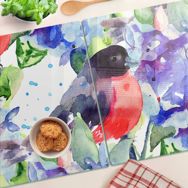 Snijplanken van glas Een vogel tegen een achtergrond van bloemen