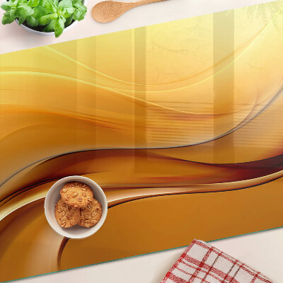 Snijplanken van glas Golven in goudtinten