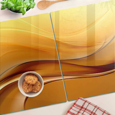 Snijplanken van glas Golven in goudtinten