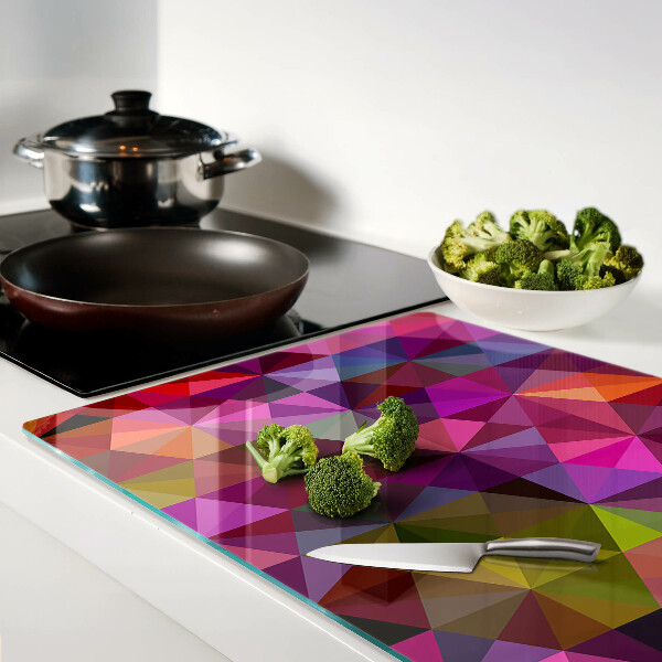 Glazen snijplanken Geometrische vormen in roze en paarse tinten.