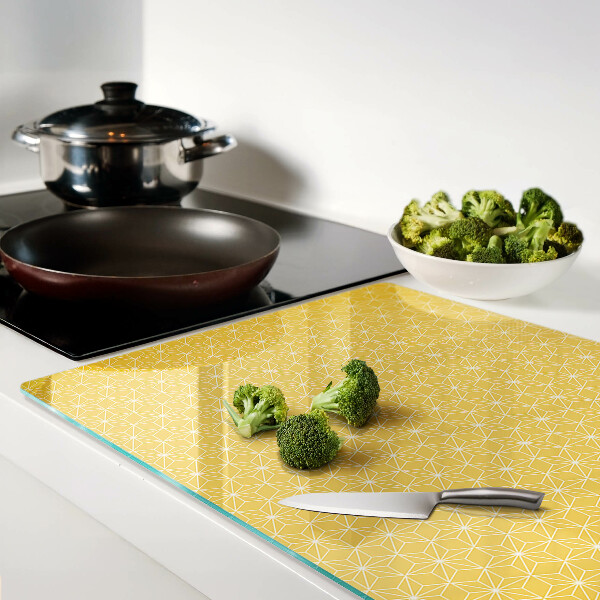 Glazen snijplanken Levensbloem op een gele achtergrond