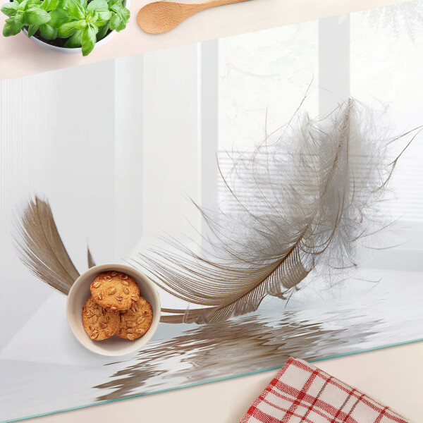 Deska kuchenna szklana Pióro na tle wody