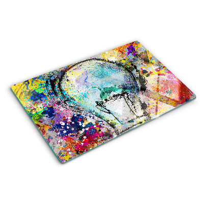 Snijplanken glas Gloeilamp op een gekleurde achtergrond