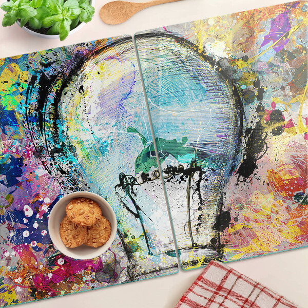 Snijplanken glas Gloeilamp op een gekleurde achtergrond