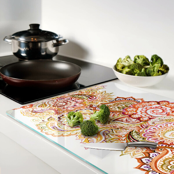 Snijplanken van glas Paisley-motief in tinten rood en goud.