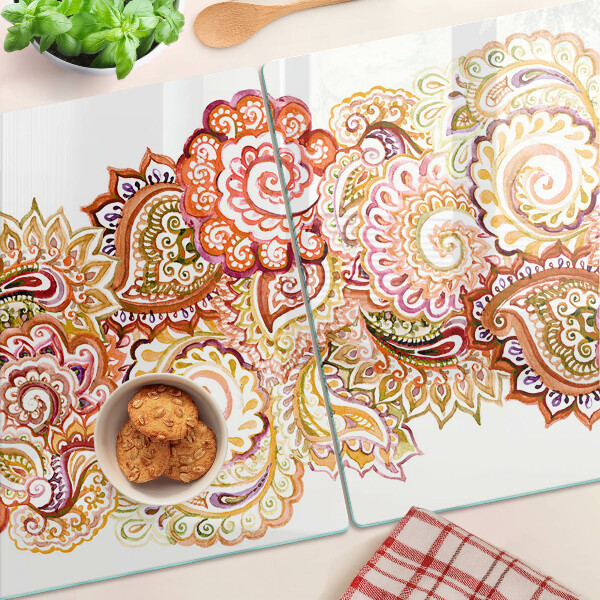 Snijplanken van glas Paisley-motief in tinten rood en goud.