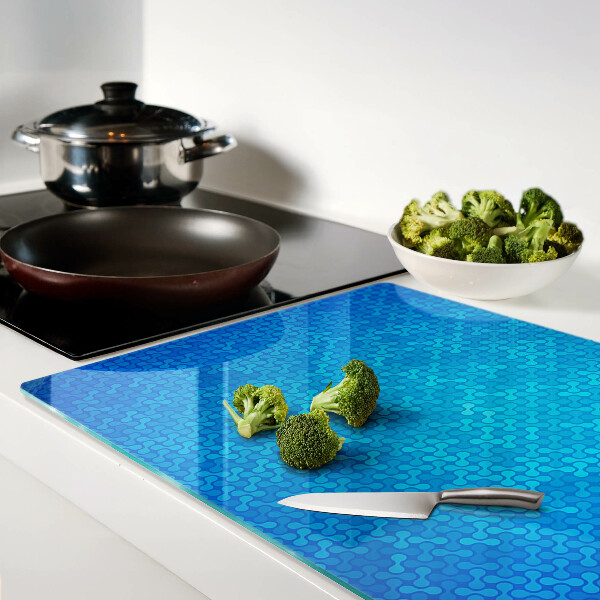 Snijplanken van glas Een golvend patroon in verschillende blauwtinten.