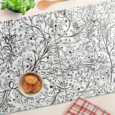 Snijplanken van glas Een plantenpatroon met delicate takken.