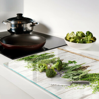 Snijplanken van glas Kruiden op een houten achtergrond