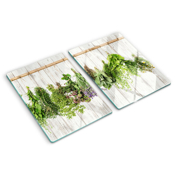 Szklana deska do krojenia Zioła na tle drewnianym
