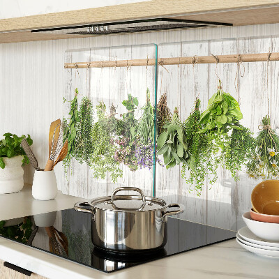 Snijplanken van glas Kruiden op een houten achtergrond