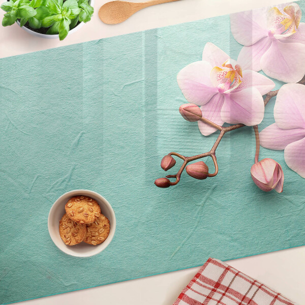 Szklana deska kuchenna Orchidee na tle niebieskim