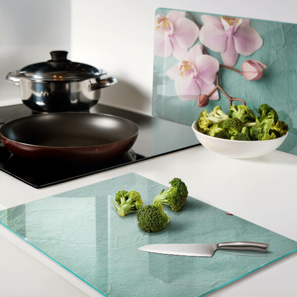 Szklana deska kuchenna Orchidee na tle niebieskim