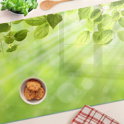 Szklana deska do krojenia Zielone liście na tle światła