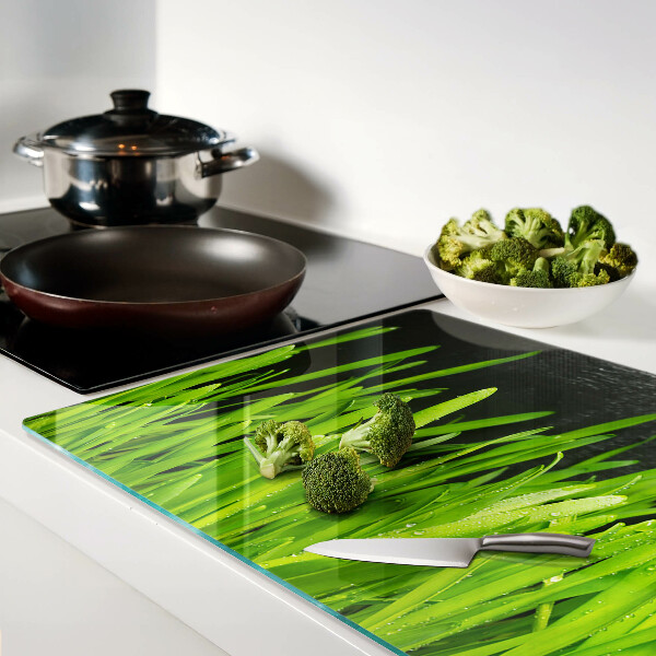 Snijplanken van glas Groen gras met waterdruppels