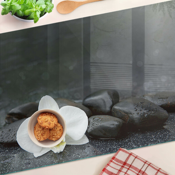 Szklana deska do krojenia Kwiat orchidei na kamieniach